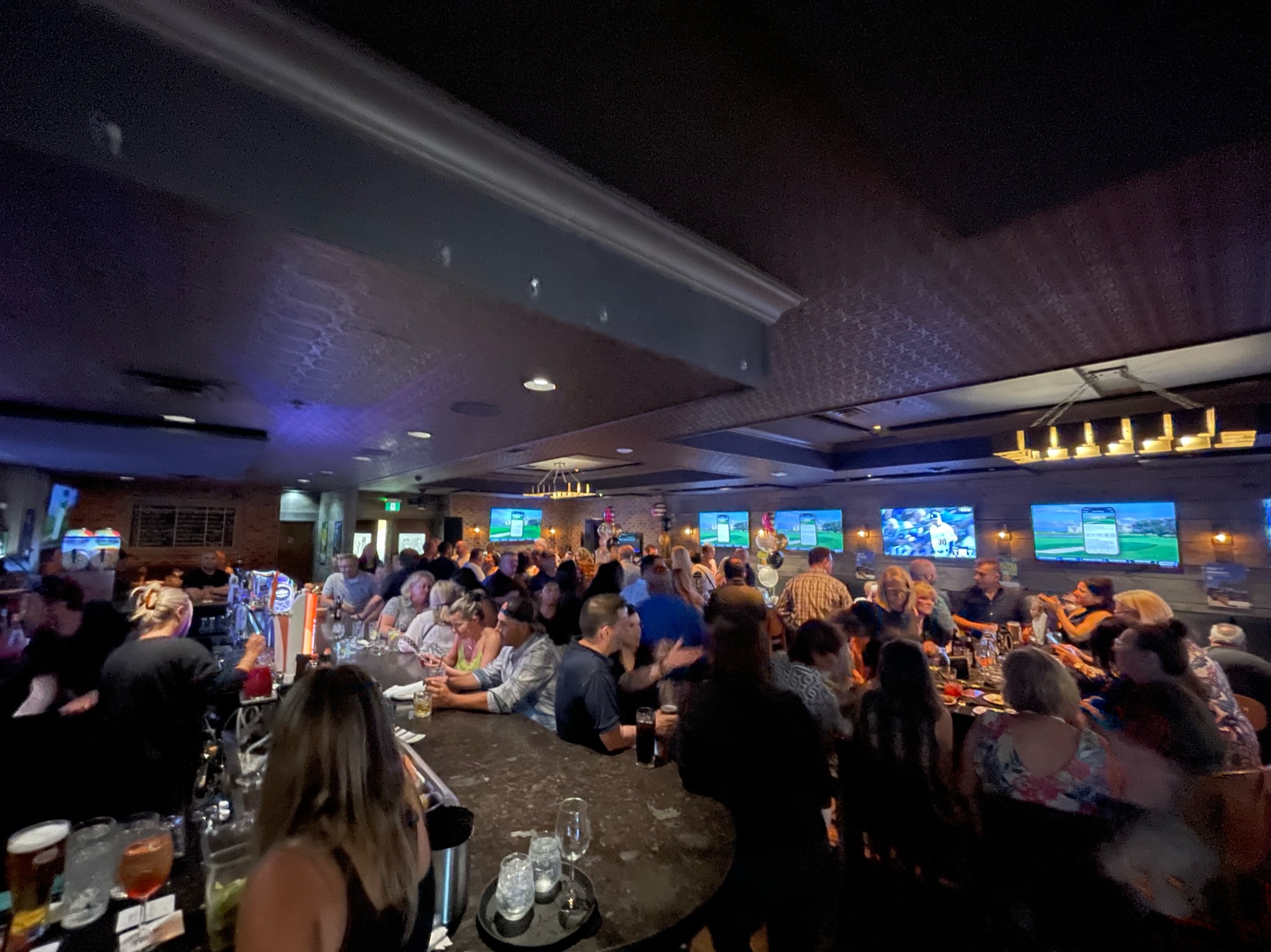 The main dining room set for a large group at The Oakville Pump & Patio